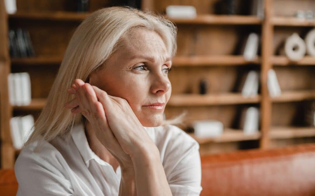 middle aged mature woman relaxing on the couch sofa