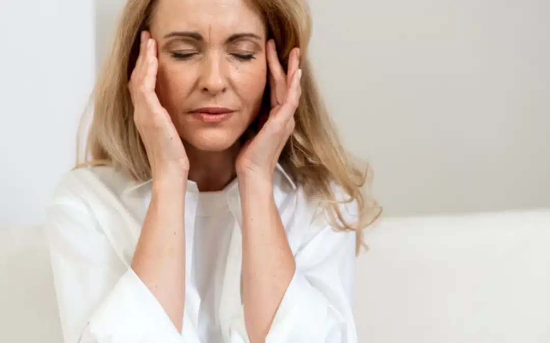 mature woman coping with migraine headache ()